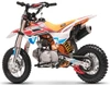 Left side of the orange TrailMaster SK110ES dirt bike showing the engine, foot shifter and chain drive.