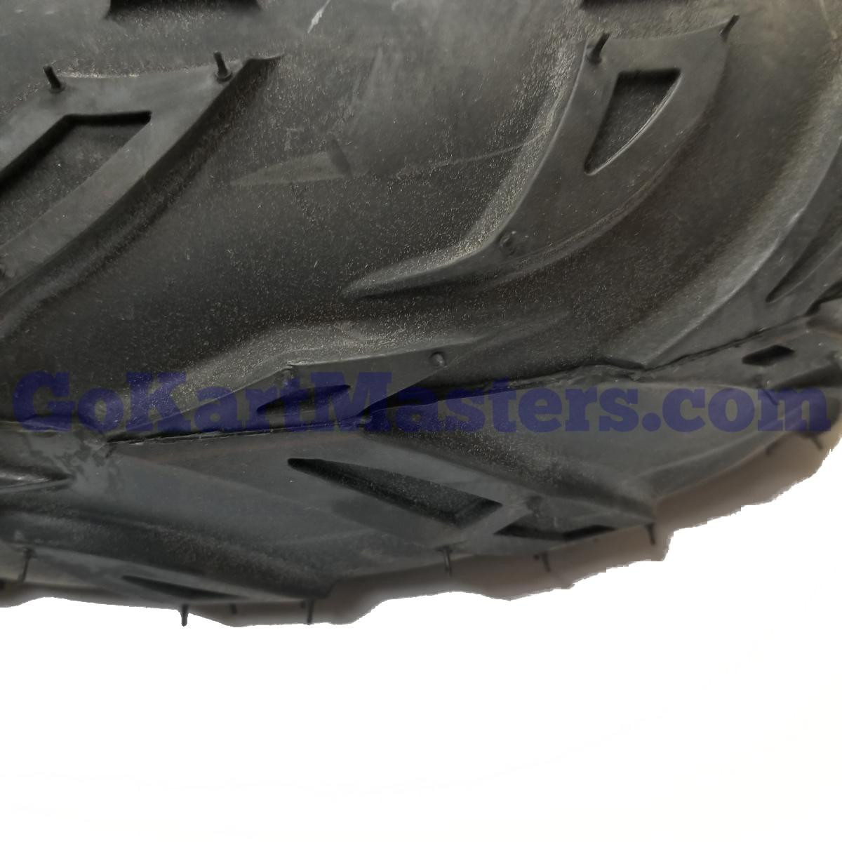 Mini XRX Plus & Mini XRX-R Plus Left Front Wheel & Tire Assembly 145/70-6, close-up view of the black tire’s deep tread pattern and rubber surface.