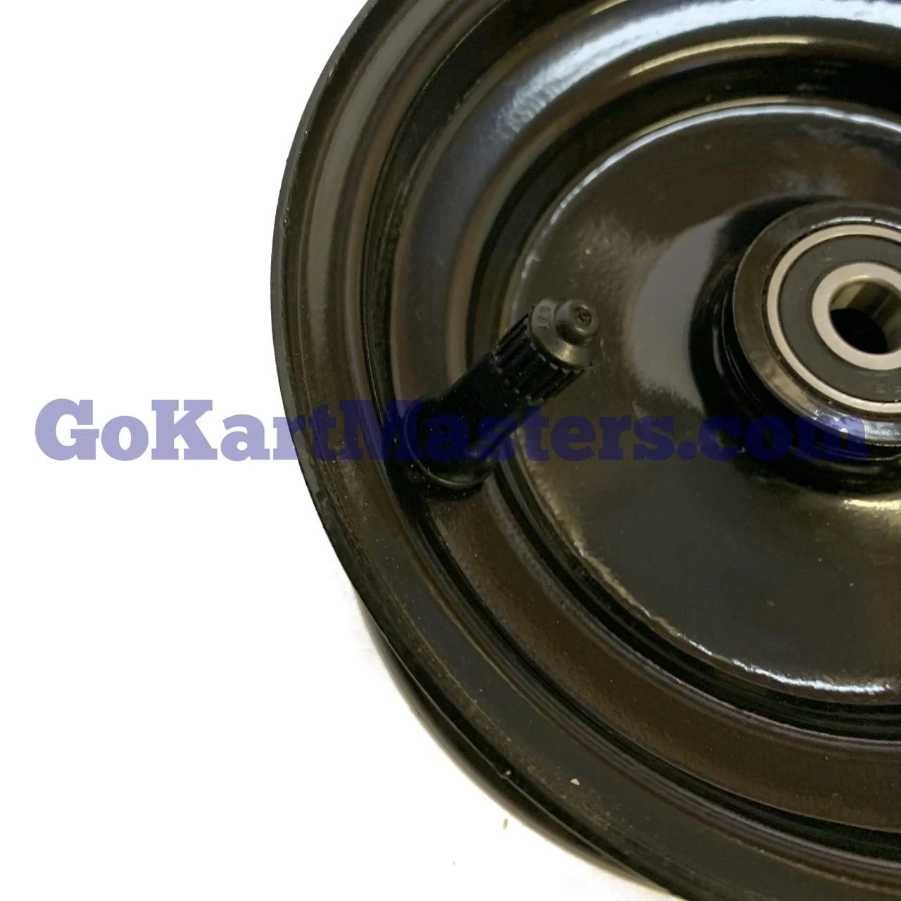 TrailMaster Go Kart Front Rim 6'' Mini & Mid XRS, close-up view of the black plastic rim with a mounted wheel and visible bearing.