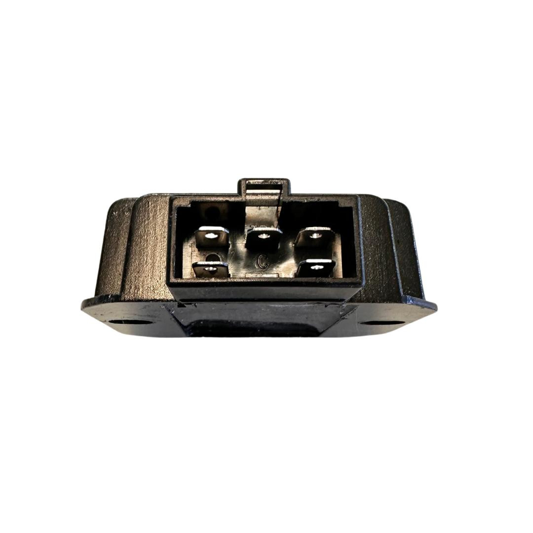 Trailmaster Mid Size go kart regulator for 2024 models, close-up view of the black electrical component with metal contacts.