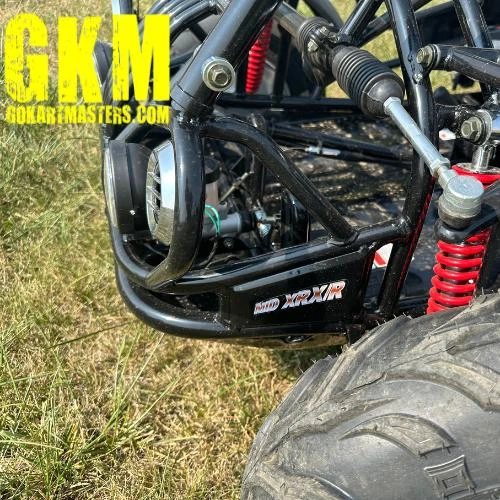 TrailMaster Mid XRX-R Go Kart for Kids with Reverse, Electric Start, and 5 Point Harness, assembled and viewed from the front side showing the black frame, red suspension springs, and large tire.