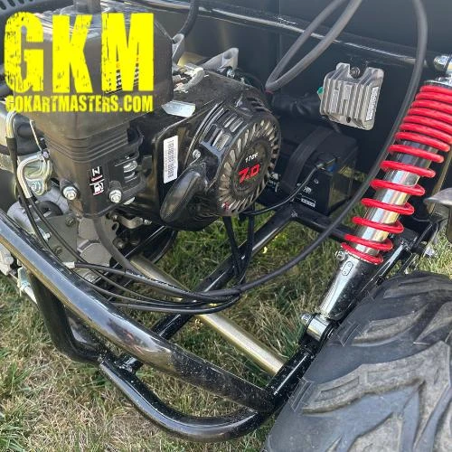 TrailMaster Mid XRX-R Go Kart For Kids with Reverse, Electric Start, 5 Point Harness, close-up of engine and suspension.