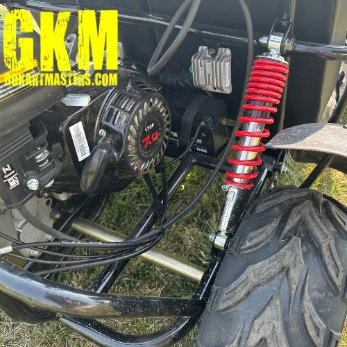 TrailMaster Mid XRX-R Go Kart for Kids with Reverse, Electric Start, 5 Point Harness, assembled close-up showing engine, suspension, and tire details.