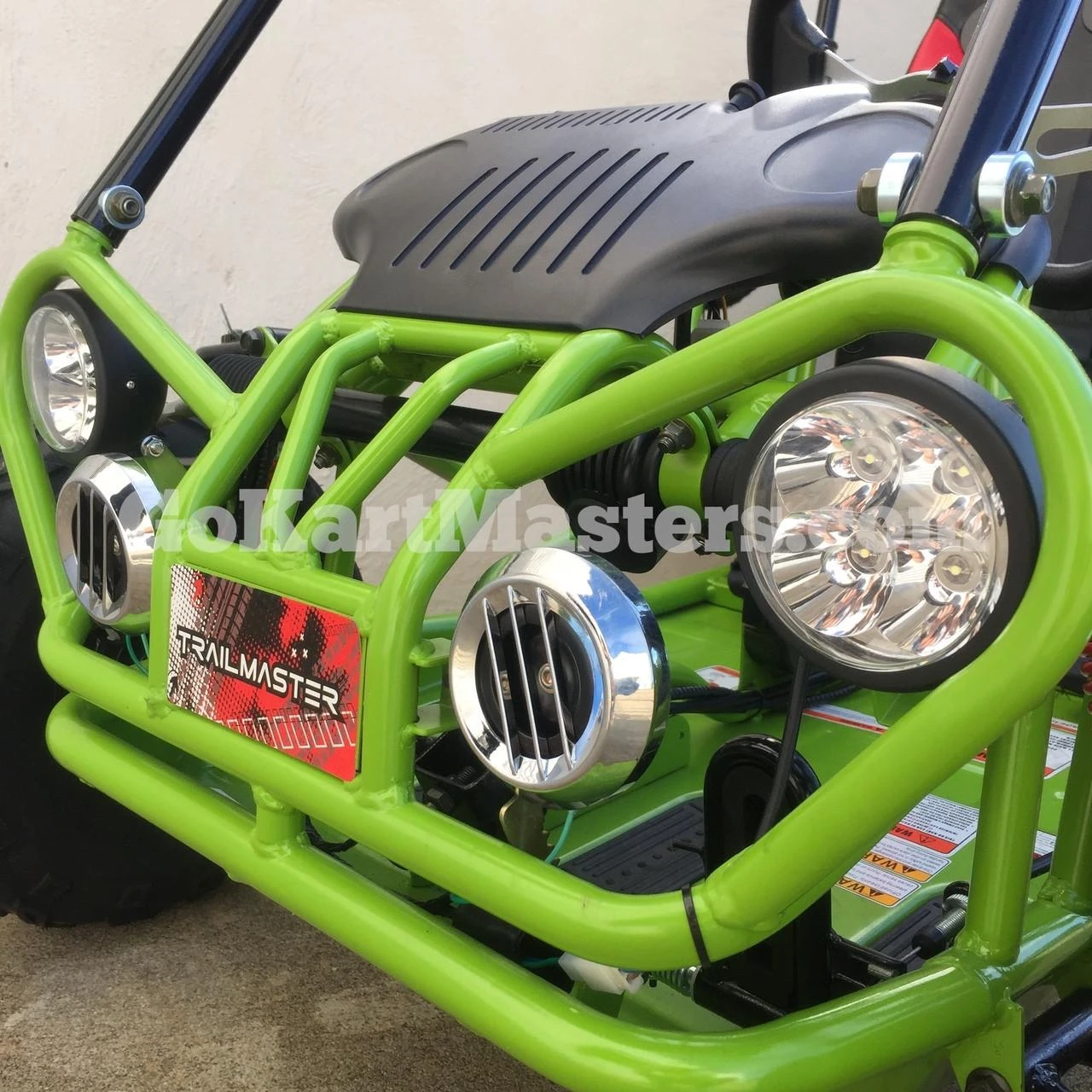 TrailMaster Mini XRX/R+ Go Kart with Reverse, assembled youth go-kart with a vibrant green frame, large headlights, and racing-inspired design suitable for children ages 4 and up.