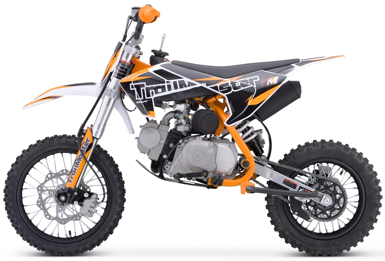 Trailmaster TM23 Youth Dirt Bike 29-inch Seat, semi-auto transmission, electric start, with knobby tires and orange and black frame.