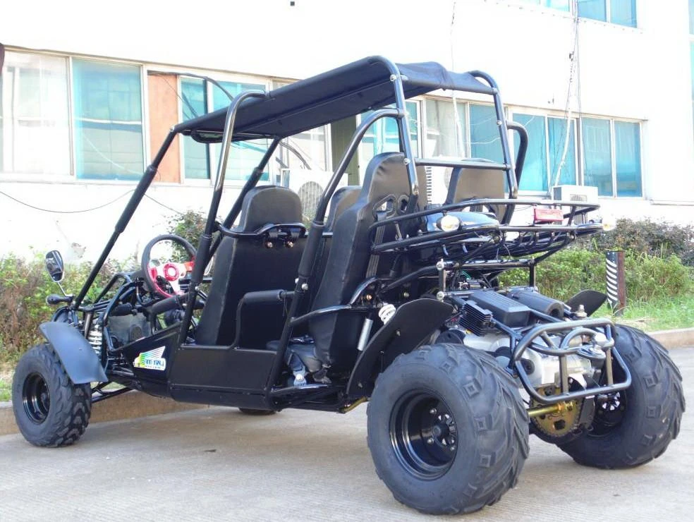 TM 300 XRS-4E 4 Seater Go Kart for Families, black off-road go-kart with four seats, rugged tires, and safety frame, parked outdoors near a building.