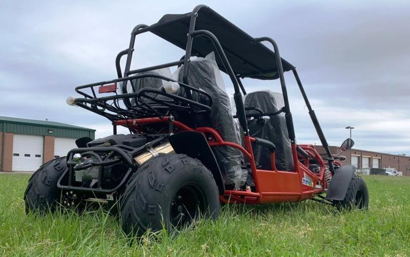 TM 300 XRS-4E 4 Seater Go Kart for Families, red off-road go-kart with four seats, safety bars, and rugged tires on grassy field.