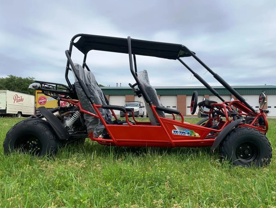 TM 300 XRS-4E 4 Seater Go Kart for Families, red off-road go-kart with four seats, safety bars, and canopy for family outdoor recreational activities.