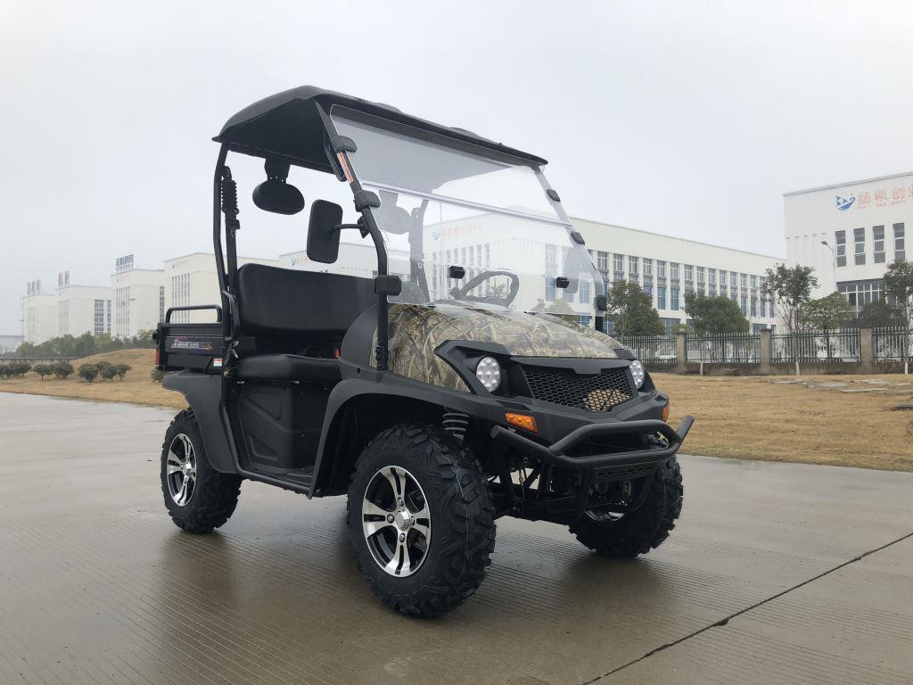 Trailmaster Taurus 200U Utility SXS UTV, rugged off-road utility vehicle with camouflage accents, black body, large tires, and compact design, suitable for outdoor tasks and recreational use.