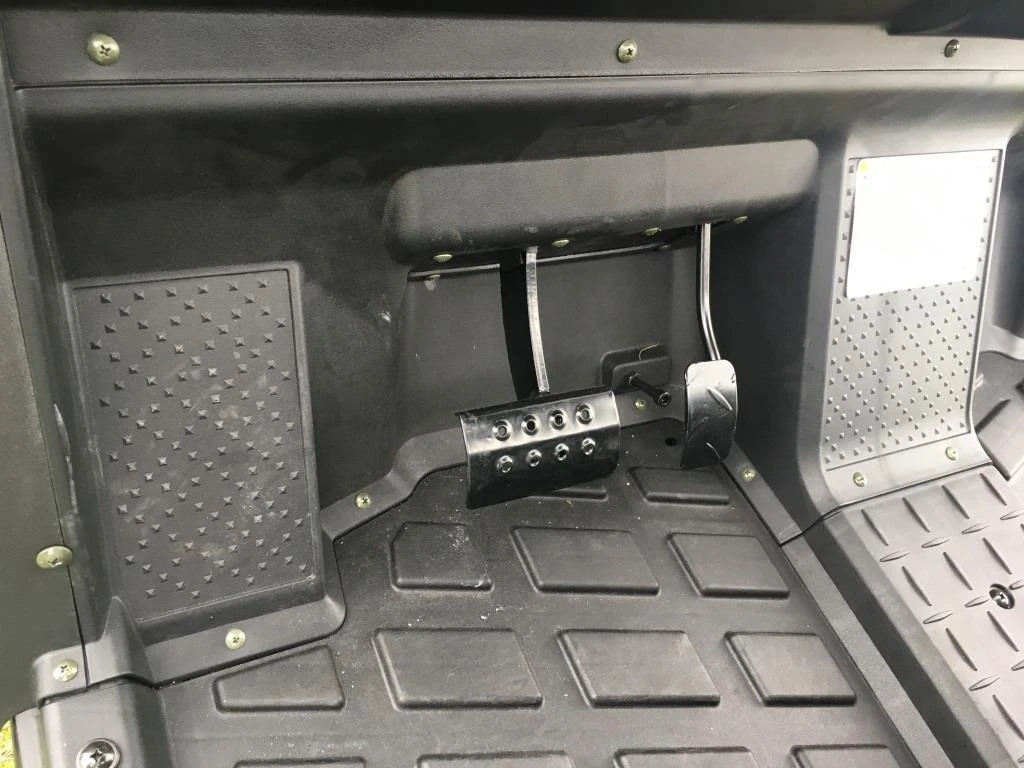 Trailmaster Taurus 200U, Utility SXS UTV interior with foot pedals and rugged floor mat.