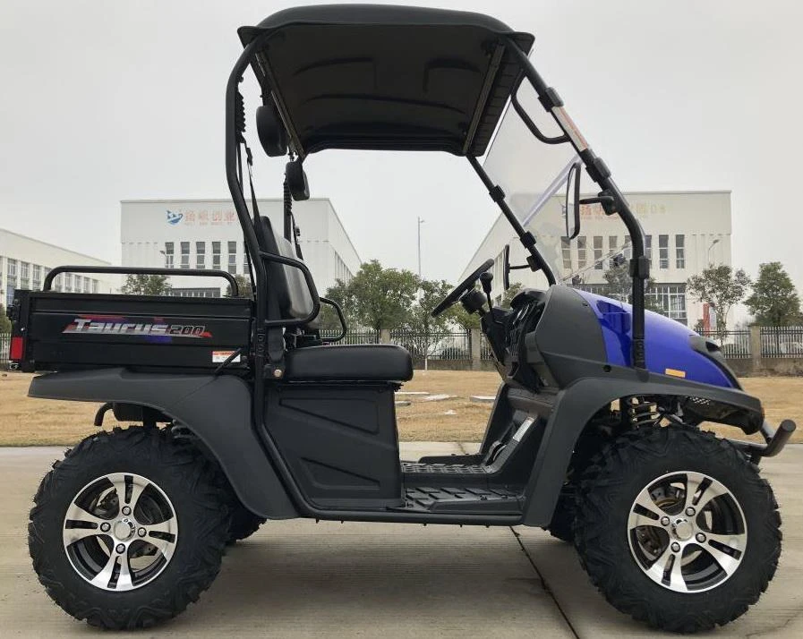 Trailmaster Taurus 200U Utility SXS UTV, side view of compact off-road utility vehicle with rugged tires, black seating, and canopy in outdoor setting.