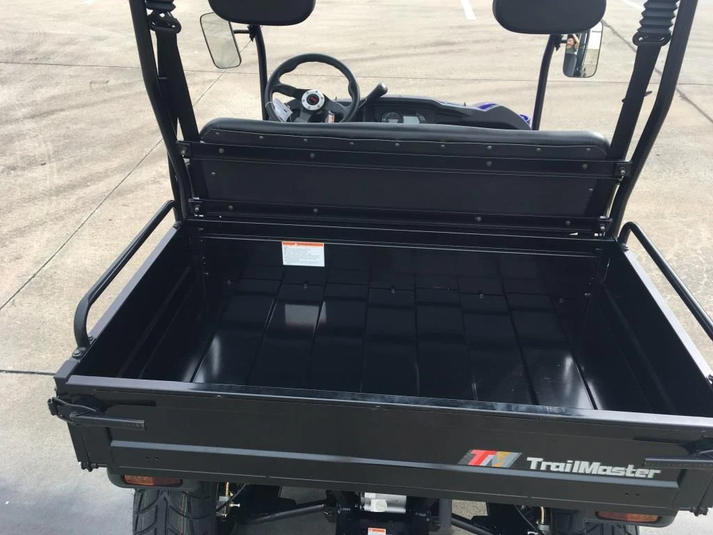 Trailmaster Taurus 200U Utility SXS UTV, front view showing the cargo bed and steering wheel inside the vehicle.