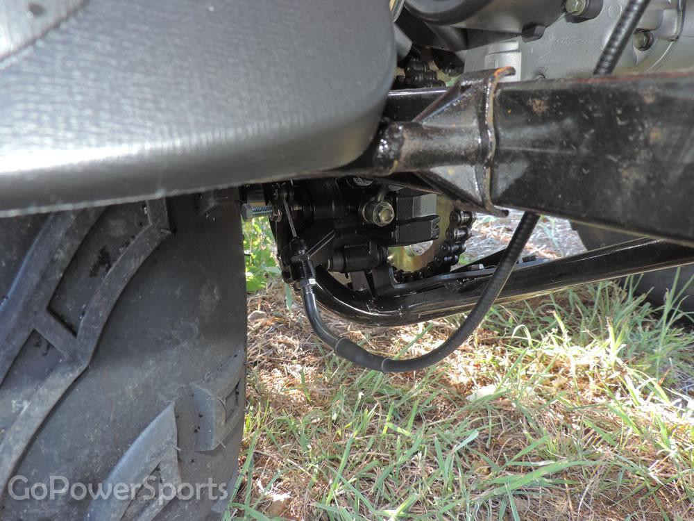 TrailMaster 200 XRS Go Kart with Carburetor, close-up view of the engine and carburetor assembly under the vehicle.