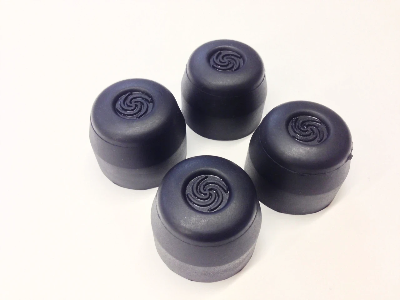 Set of four original rubber hub caps for the TrailMaster 200 XRX go-kart.