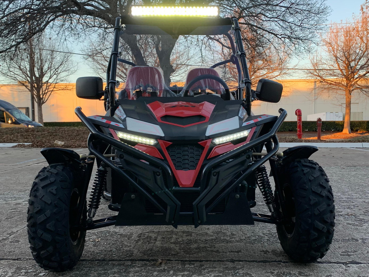 TrailMaster Cheetah 300EX Deluxe EFI Go-Kart/UTV Crossover, front view of a red and black off-road vehicle with LED headlights, large tires, and a protective roll cage.