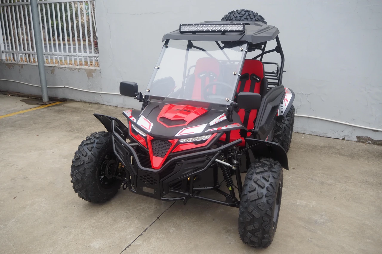 TrailMaster Cheetah 300Pro Premium EFI Go-Kart/UTV Crossover, rugged off-road vehicle with large tires, red and black design, and front bumper.
