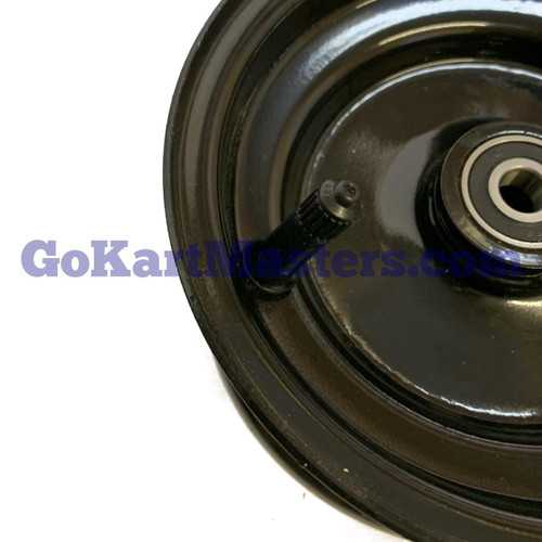 TrailMaster Go Kart Front Rim 6'' Mini & Mid XRS, close-up view of the black plastic rim with a mounted wheel and visible bearing.