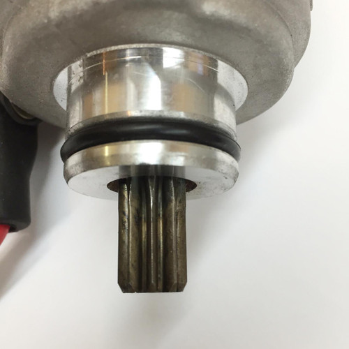TrailMaster 150 Go Kart Starter Motor, close-up image of the metallic starter motor with black gasket and gear shaft.