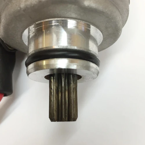 TrailMaster 200 XRS & 200 XRX Go Kart Starter Motor, close-up view of the starter motor with metal components and black rubber seal.