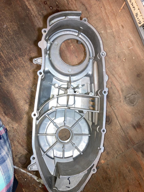 TrailMaster 300 EFI Model Go Kart CVT side cover, metallic silver side cover for go-kart engine components, with mounting holes and structural reinforcements.
