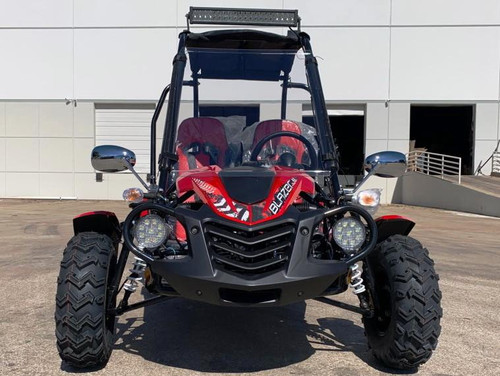 TrailMaster Blazer 200 EX Go Kart – Full-Size Youth & Teen Kart Ages 12+ with Roll Cage, Electric Start & Reverse, black and red go-kart on concrete ground in front of a modern building.