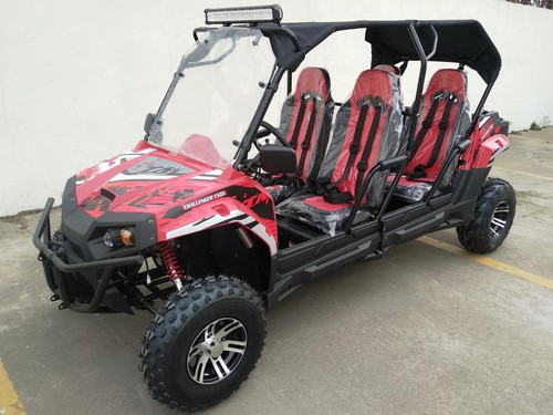 TM Challenger 4 200 EX 4 Seater 200cc SXS, red and black off-road utility vehicle with four seats, rugged tires, and protective roof for outdoor adventures.