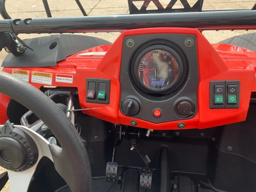 Trailmaster Challenger 200 EGX Golf Cart Style UTV, interior dashboard with speedometer and control buttons.