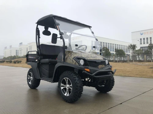 Trailmaster Taurus 200U Utility SXS UTV, rugged off-road utility vehicle with camouflage accents, black body, large tires, and compact design, suitable for outdoor tasks and recreational use.