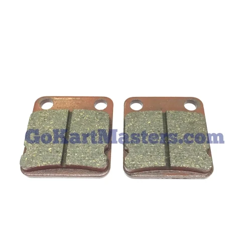 TrailMaster 200 XRS Rear Brake Pad Set, two metallic brake pads with mounting holes and wear surfaces for ATV or motorcycle.