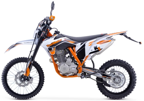 TrailMaster TM31X-250 Deluxe Full-Size Manual Dirt Bike, a white and orange off-road motorcycle with knobby tires, front and rear disc brakes, and a sturdy frame designed for dirt riding.