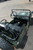 TM Army Vehicle Jeep-style ATAC GK-6125A, green camouflage mini off-road electric vehicle with black seats, steering wheel, and durable tires.