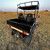 TM Challenger 200 EUX | YOUTH SXS | EFI | UTILITY BED | PREMIUM PACKAGE, a compact electric utility side-by-side vehicle with a black utility bed, off-road tires, and a canopy, designed for versatile outdoor and work用途.