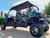 TM Challenger 4 200 EX 4 Seater 200cc SXS, off-road utility vehicle with four seats, canopy top, rugged tires, and sporty design in black and green colors.