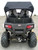TrailMaster Challenger 200EX 4-Seater go-kart with roll cage and off-road tires parked outdoors