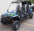 TM Challenger4 300 EX 4 Seater Family Buggy, rugged green and blue off-road vehicle with four wrapped seats, protective roof, open sides, and large knobby tires.