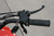 TM 3050c Mini 110cc ATV, close-up of the right handlebar showing the throttle grip, brake lever, and key ignition with key fob.