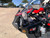 TMBlazer 200EX PREMIUM Sport Go Kart, close-up of the front section with red and black body, chrome mirror, and visible engine components.