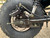 TM Hurricane 200X Mini Bike, close-up view of the rear wheel and suspension system.
