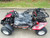 TM Mid Size Blazer 200R Go Kart with Reverse, side view showing the seat, steering wheel, and rugged tires.
