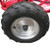 TM Mid XRX Go Kart for age 8 and up, close-up of a large rugged black tire with silver rim.