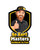 TM Mini XRX+ Kids Go Kart Ages 4+ logo with a cartoon man giving a thumbs up, wearing a helmet and sunglasses, with bold yellow and black text.