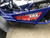 TM 200 XRX EFI PREMIUM Go Kart, close-up of the blue chassis and side panel with red and black decals.