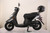 TM Flash 50 Scooter Moped, black scooter with a top case and sleek design.