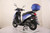 TM Flash 50 Scooter Moped, blue and black scooter with top-mounted blue storage box and side stand on a white surface