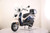 TM Sorento 200A Scooter Moped, modern electric scooter with a sleek blue and white design, windshield, and storage box.