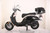 TM Sorento 200A Scooter Moped, black and white electric scooter with top case for storage.