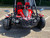 TM Blazer i2K Full Size Battery Powered Go Kart, front view showing the red and black go-kart with large off-road tires, side mirrors, and a roll cage.