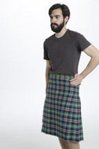 Abel Bespoke Kilt worn with a grey T-shirt, three-quarter view
