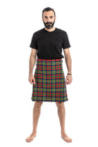 Man wearing a bespoke kilt in yellow, red and green tartan with a black t-shirt, front view