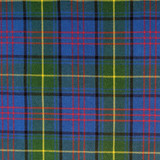 Close-up of navy and green tartan fabric with red and white lines for a bespoke kilt